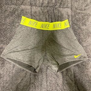 Grey and neon yellow Nike girls size large shorts